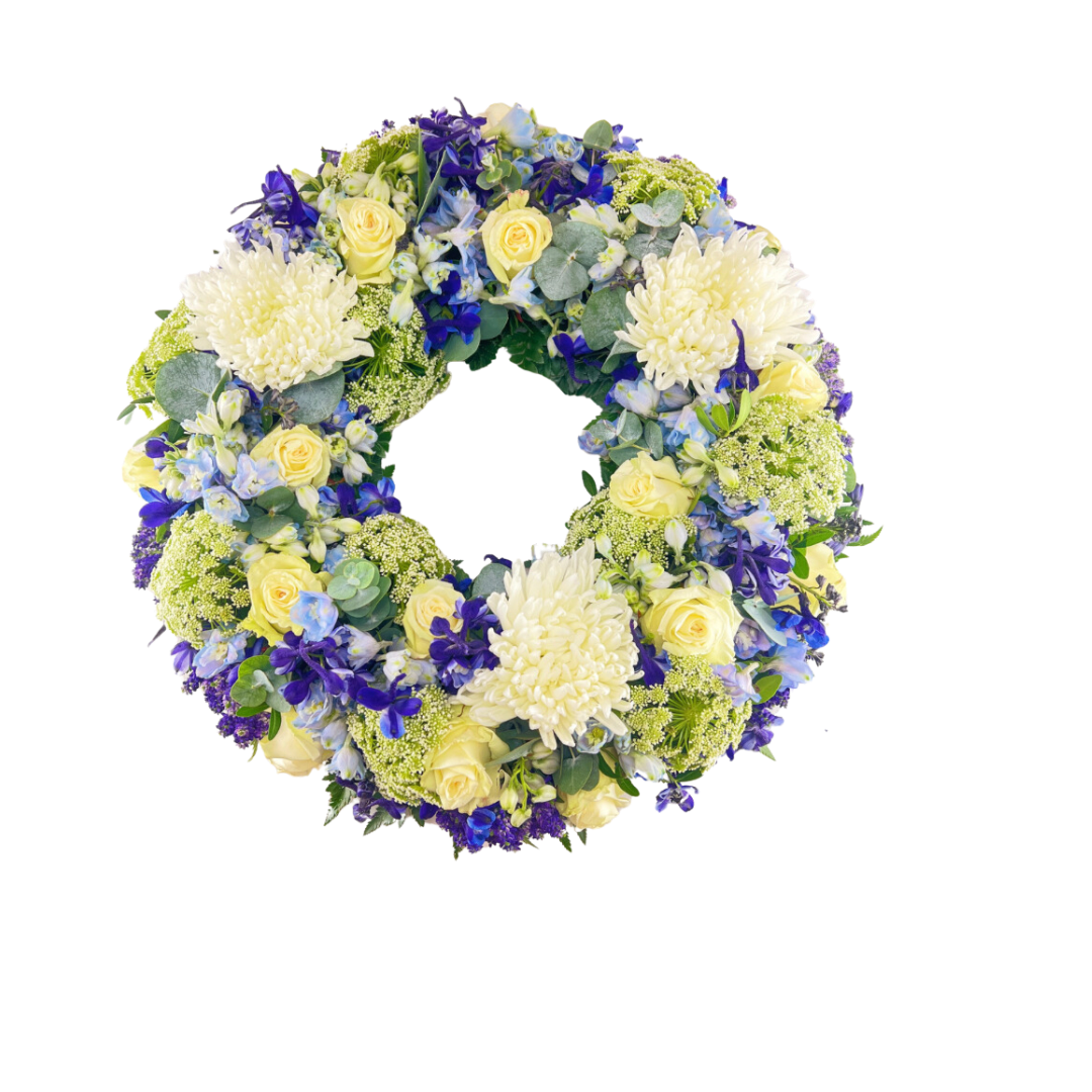 Hvid og Blå Rundkrans - begravelseskrans med hvide og blå blomster